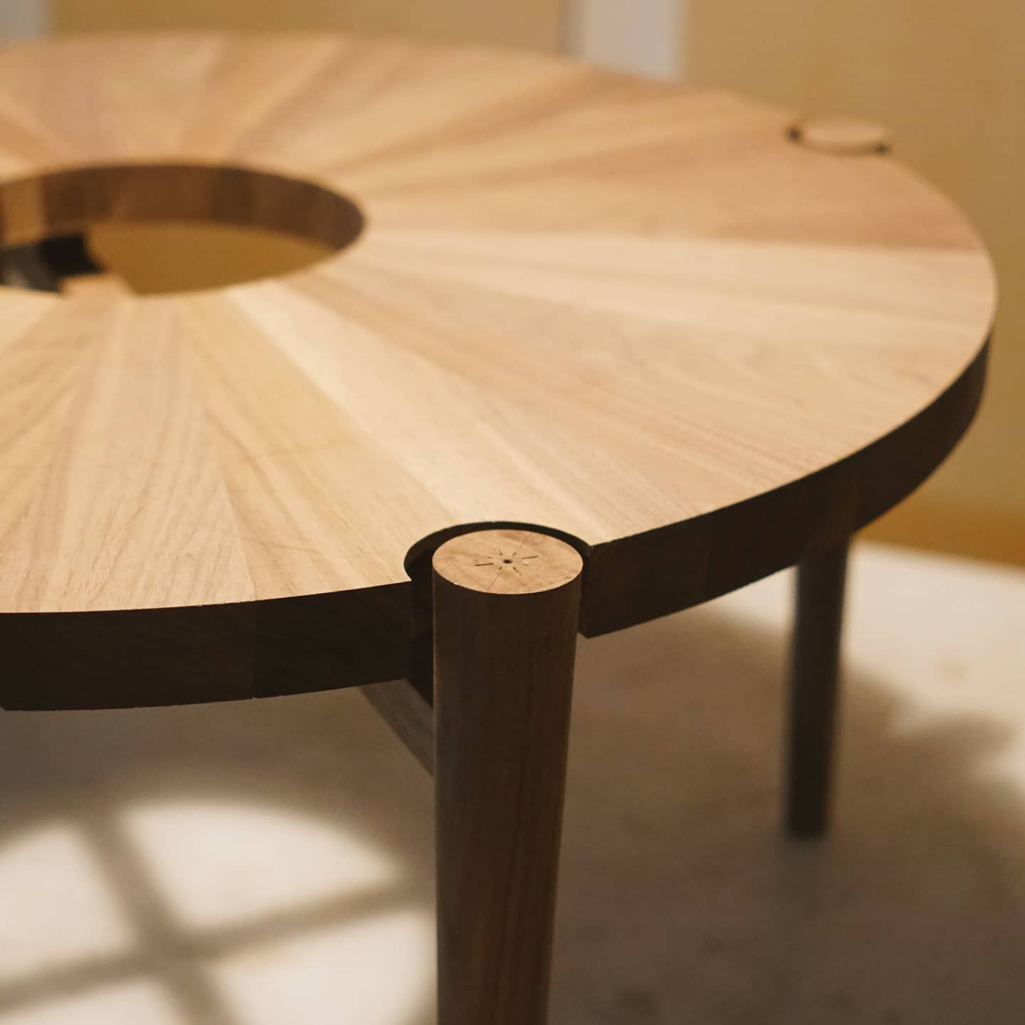 May 25th, 2021: Some behind the scenes from our circular coffee table build! Pictured here is the process of routing out the leg inserts in the table top.